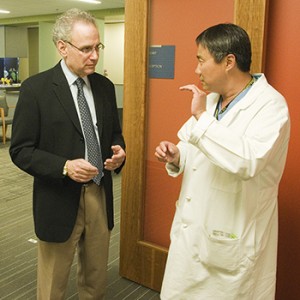 Dr. Stanley Herring (left), rehabilitation, sports and orthopedic medicine, and Dr. Fangyi Zhang (right), neurosurgery and spine injury, at Harborview Medical Center.