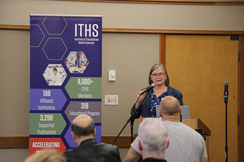 Dr. Sarah Shannon speaking at a podium