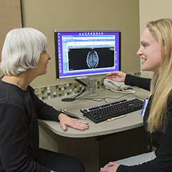 Dr. Shana Johnson, rehabilitation medicine, reviewing images with a patient at the UW Medicine Multiple Sclerosis Center at Northwest Hospital & Medical Center.