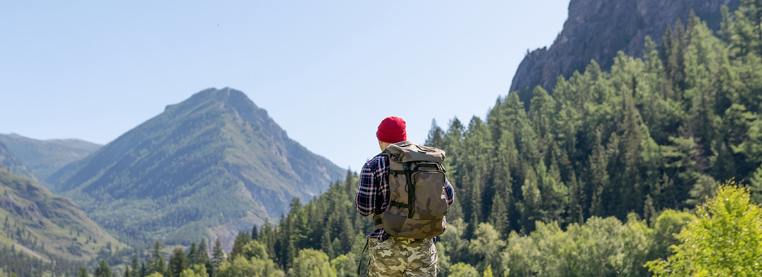 a lone hiker in the mountains
