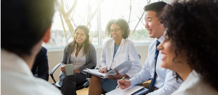 doctors and community members laughing together